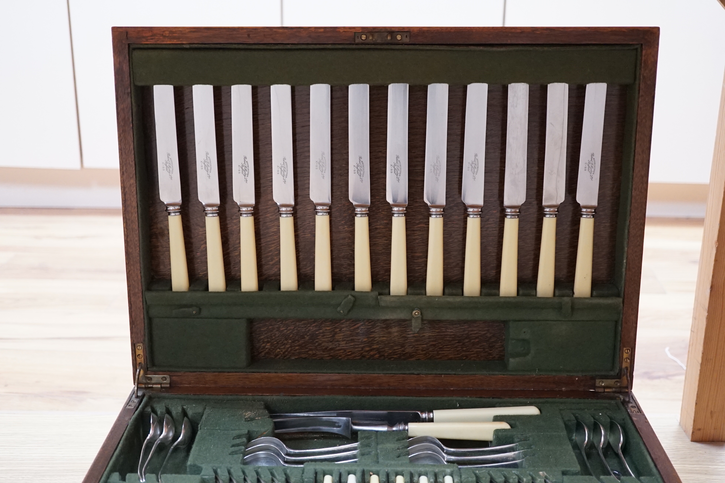 An oak cased canteen of silver plated flatware, 51cm wide